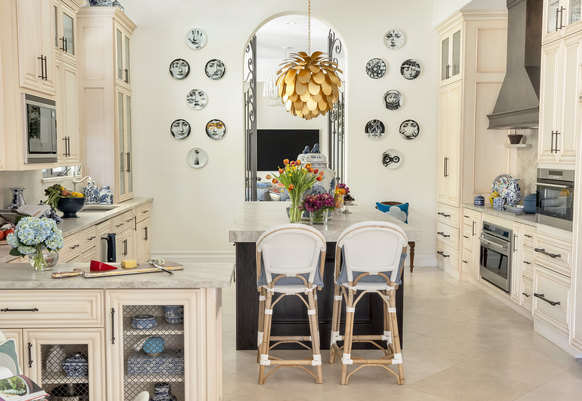 pinecrest, fl residence project - Kitchen with serena and lily chairs, fornasetti wallplates and visual comfort pendant