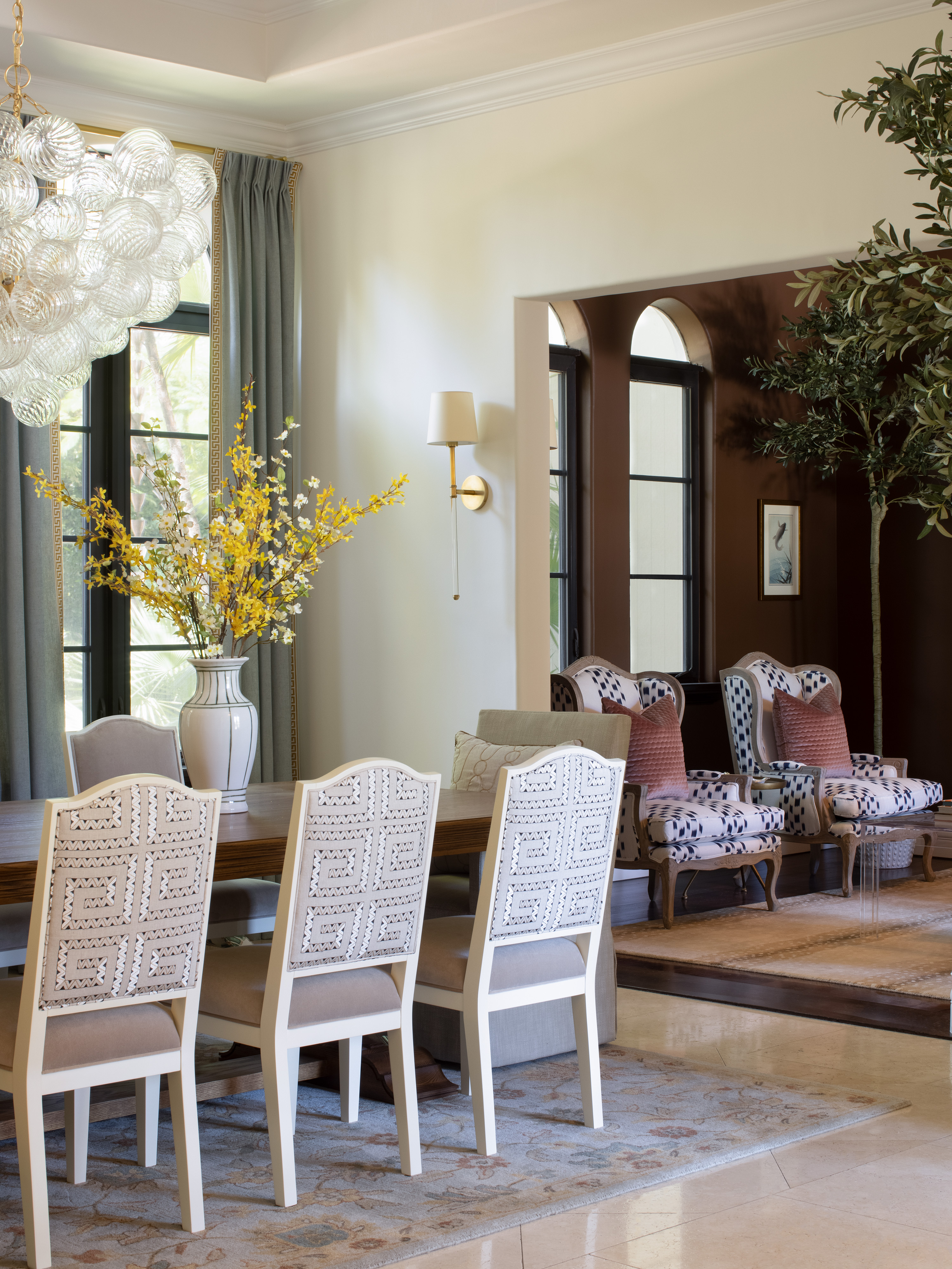 pinecrest, fl residence project - dining room with chaddock dining table, made goods dining chairs, schumacher textile, visual comfort chandelier and sconces