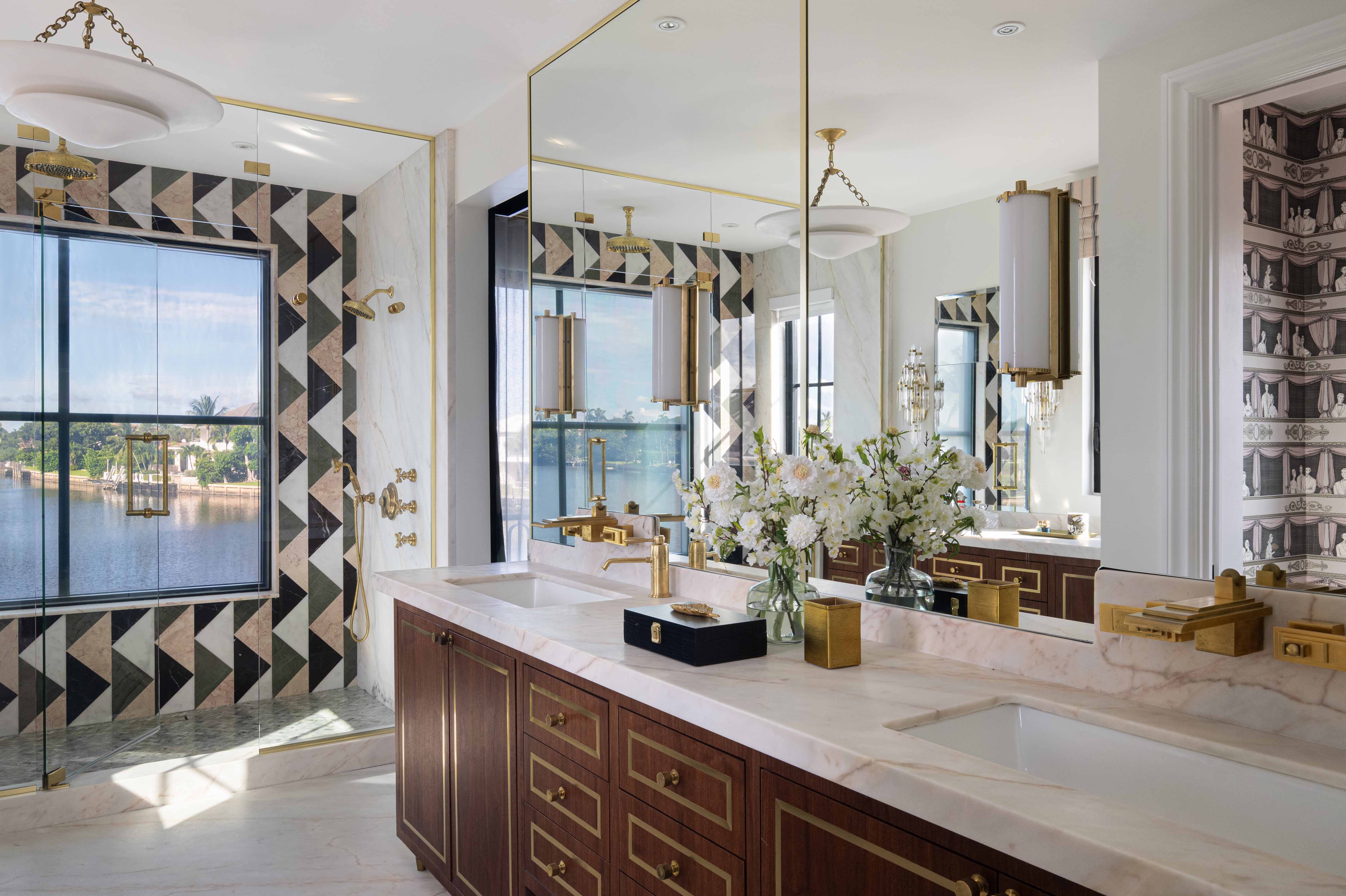 Primary bathroom suite with custom cabinetry and statement marble